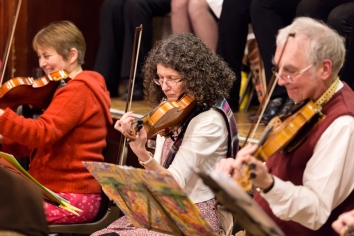 Three violinists playing