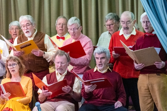 Group of mainly men singing